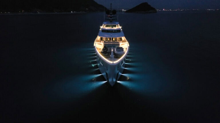Alia Yachts AL WAAB at night with hull underwater lights on
