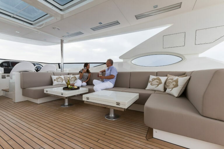 Couple enjoying each others company on Alia Yachts ALIYONI sun deck