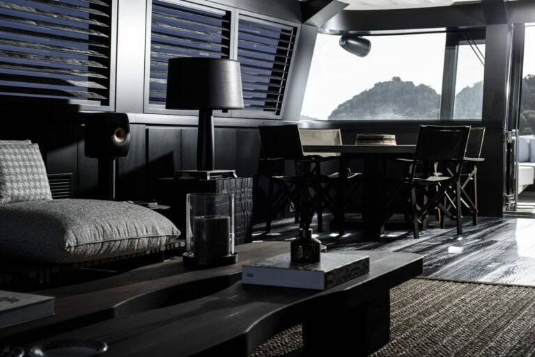 Superyacht lounge with sofa, dinning table and expensive decor